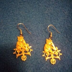 bronze-like teddy bear and Renaissance design earrings